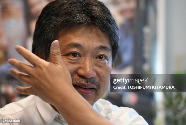 Japanese film director Hirokazu Kore-eda receives an interview with Agence France-Presse on his Palme d'Or award winning movie, "Shoplifters" at his...
