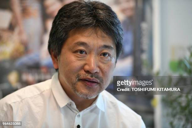 Japanese film director Hirokazu Kore-eda receives an interview with Agence France-Presse on his Palme d'Or award winning movie, "Shoplifters" at his...