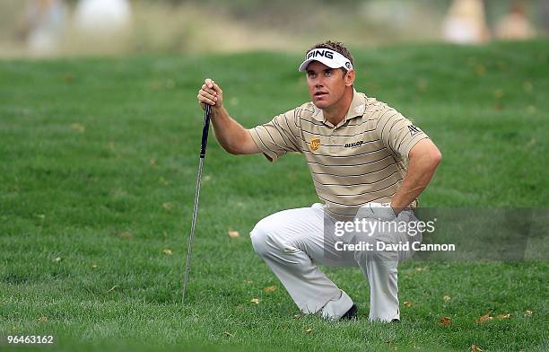 Lee Westwood of England plays his second shot at the 16th hole during the third round of the 2010 Omega Dubai Desert Classic on the Majilis Course at...