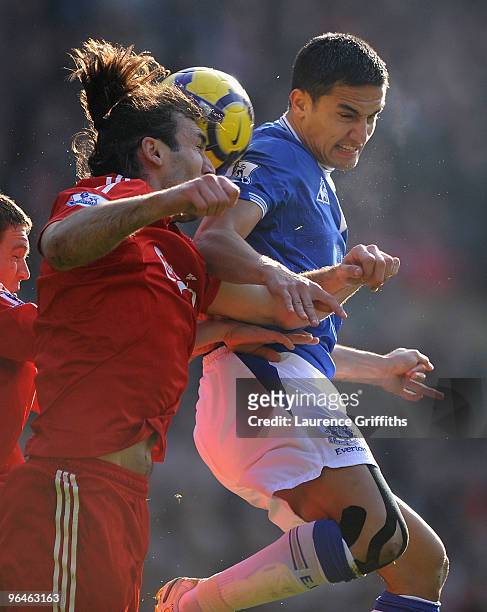 Sotiros Kyrgiakos of Liverpool competes for te ball with Tim Cahill of Everton during the Barclays Premier League match between Liverpool and Everton...