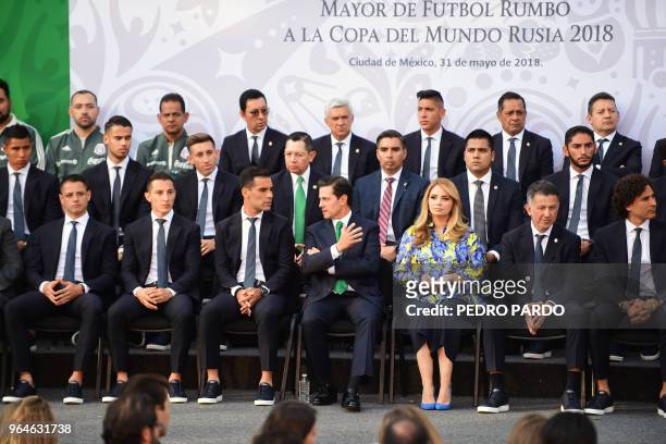 Mexican President Enrique Pena Nieto is pictured next to his wife Angelica Rivera , Mexico's national football team coach Colombian Juan Carlos...
