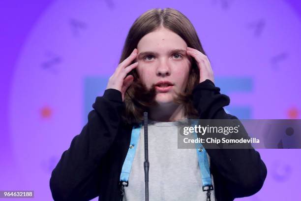 Erin Howard successfully spells the word 'sgenestrole' during the final rounds of the 91st Scripps National Spelling Bee at the Gaylord National...