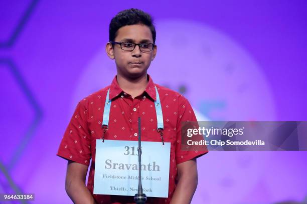 Sravanth Malla successfully spells the word 'ispaghul' during the final rounds of the 91st Scripps National Spelling Bee at the Gaylord National...