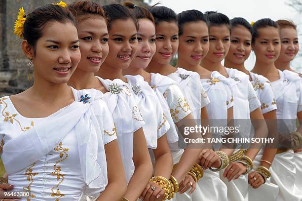 Cambodian dancers pose for pictures at the Preah Vihear temple in Preah Vihear province, 500kms north of Phnom Penh, near the disputed border with...