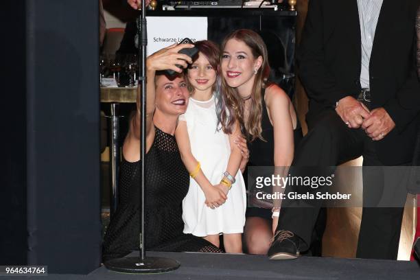 Giulia Siegel and Ruby Vivian Kaefer,daughter of Laura Kaefer, and her half-sister Alana Siegel during the surprise party for the worldwide comeback...