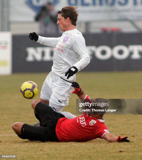 David Pisot of Ingolstadt and Bjoern Lindemann of Osnabrueck battle for the ball during the third league match between FC Ingolstadt 04 and VfL...