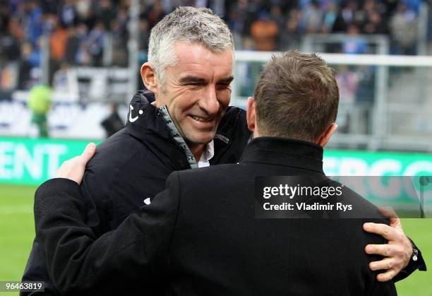 Hannover coach Mirko Slomka gives a hug to Hoffenheim coach Ralf Rangnick ahead the Bundesliga match between 1899 Hoffenheim and Hannover 96 at...