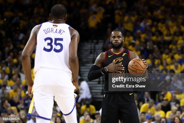 LeBron James of the Cleveland Cavaliers defended by Kevin Durant of the Golden State Warriors during the first half in Game 1 of the 2018 NBA Finals...