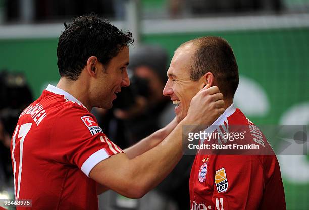 Arjen Robben of Muenchen celebrates scoring the first goal with Mark van Bommel during the Bundesliga match between Vfl Wolfsburg and FC Bayern...