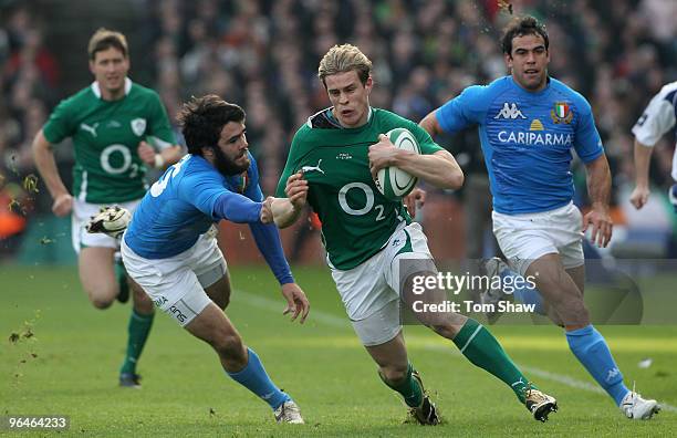 Andrew Trimble of Ireland is tackled by Luke McLean of Italy during the RBS Six Nations match between Ireland and Italy at Croke Park on February 6,...