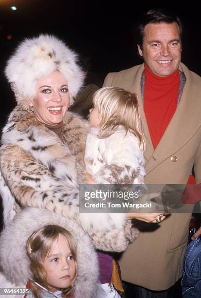 Natalie Wood and Robert Wagner with their children at the Hollywood Christmas Parade on December 19, 1976 in Los Angeles, California.