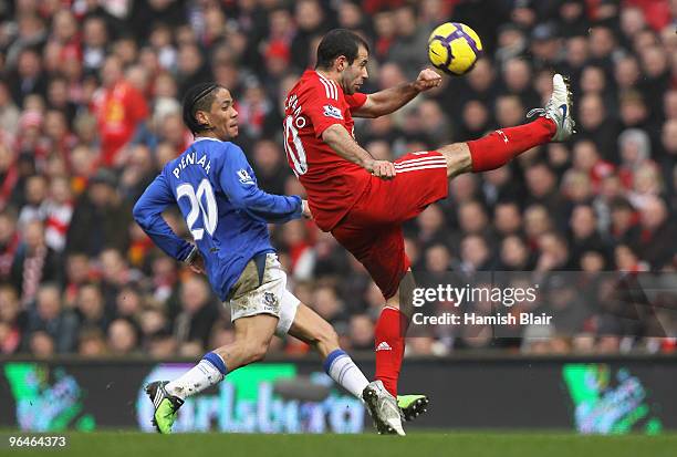 Steven Pienaar of Everton is beaten to the ball by Javier Mascherano of Liverpool during the Barclays Premier League match between Liverpool and...