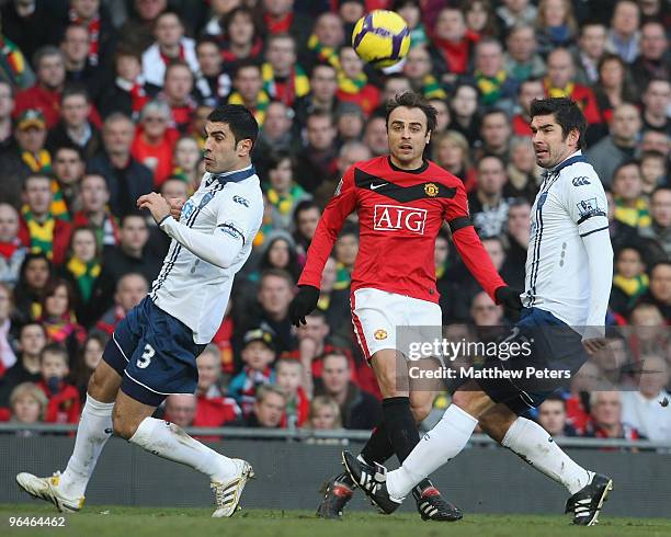 Dimitar Berbatov of Manchester United clashes with Ricardo Rocha and Richard Hughes of Portsmouth during the FA Barclays Premier League match between...