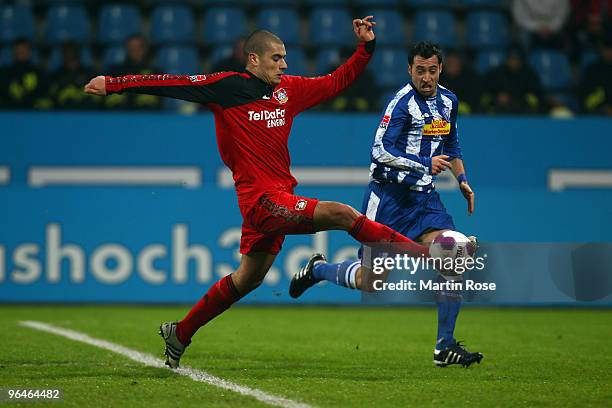 Matias Concha of Bochum and Eren Derdiyok of Leverkusen compete for the ball during the Bundesliga match between VFL Bochum and Bayer Leverkusen at...