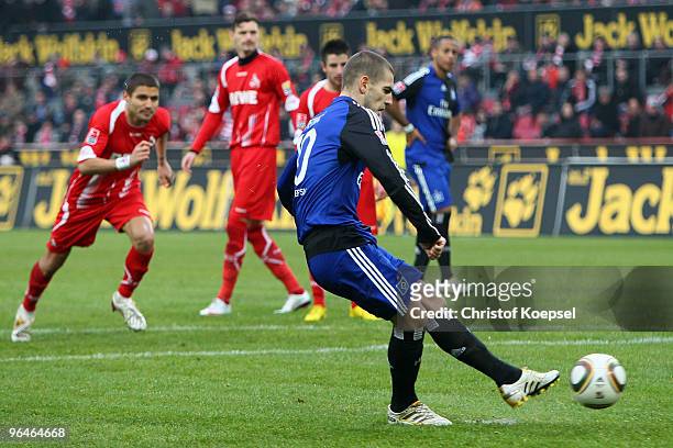 Mladen Petric of Hamburg scores the third goal by penalty during the Bundesliga match between 1. FC Koeln and Hamburger SV at the RheinEnergieStadion...