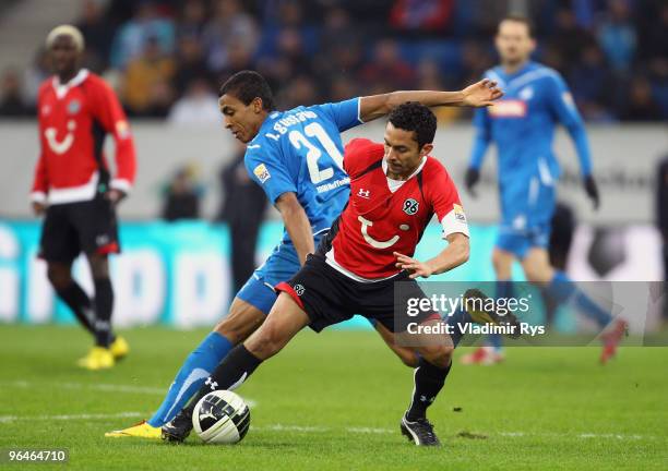 Elson of Hannover and Luiz Gustavo of Hoffenheim battle for the ball during the Bundesliga match between 1899 Hoffenheim and Hannover 96 at...