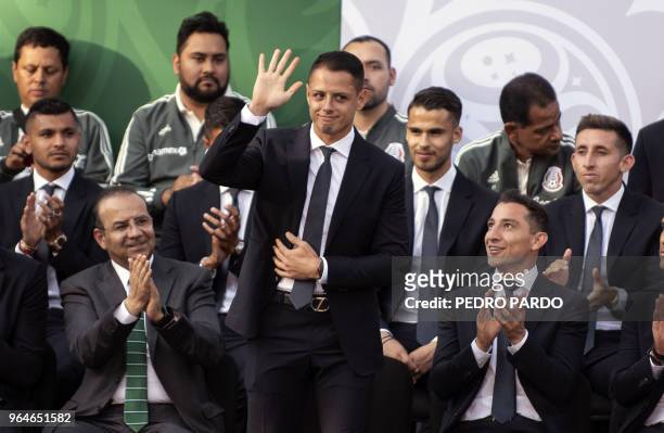 Mexican national soccer team Javier "Chicharito" Hernandez waves during a send-off ceremony at Los Pinos presidential residence in Mexico City on May...