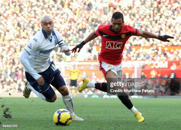 Nani of Manchester United clashes with Anthony Vanden Borre of Portsmouth during the FA Barclays Premier League match between Manchester United and...