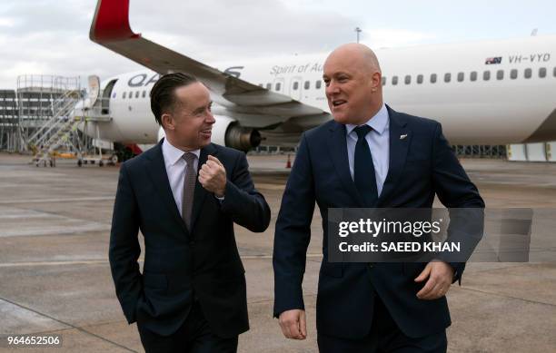 Qantas Group CEO Alan Joyce and Air New Zealand CEO Christopher Luxon walk back after a press conference on the Sydney airport tarmac on June 1,...