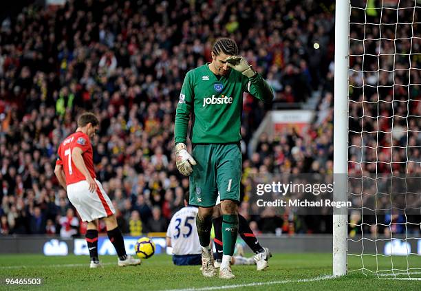 David James of Portsmouth looks dejected after conceding the 5th goal during the Barclays Premier League match between Manchester United and...
