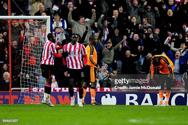 Kenwyne Jones of Sunderland celebrates his goal with Darren Bent during the Barclays Premier League match between Sunderland and Wigan Athletic at...