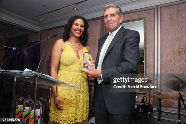 Lauren Clayton presents the 2018 Changemaker Award to Executive Director for Waterside School Duncan Edwards onstage during the Changemaker Gala at...