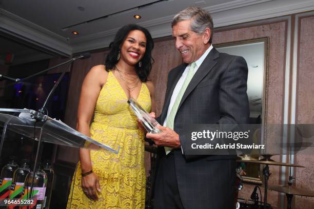 Lauren Clayton presents the 2018 Changemaker Award to Executive Director for Waterside School Duncan Edwards onstage during the Changemaker Gala at...