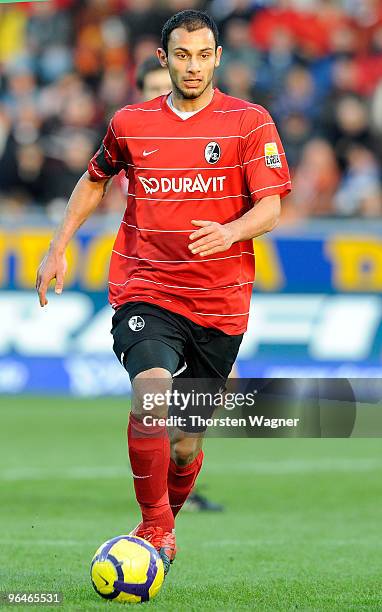 Oemer Toprak runs with the ball during the Bundesliga match between SC Freiburg and FC Schalke 04 at Badenova Stadium on February 6, 2010 in...