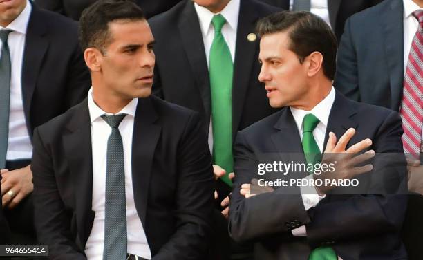 Mexican national football team captain Rafael Marquez speaks with Mexican President Enrique Pena Nieto, during a send-off ceremony at the Los Pinos...