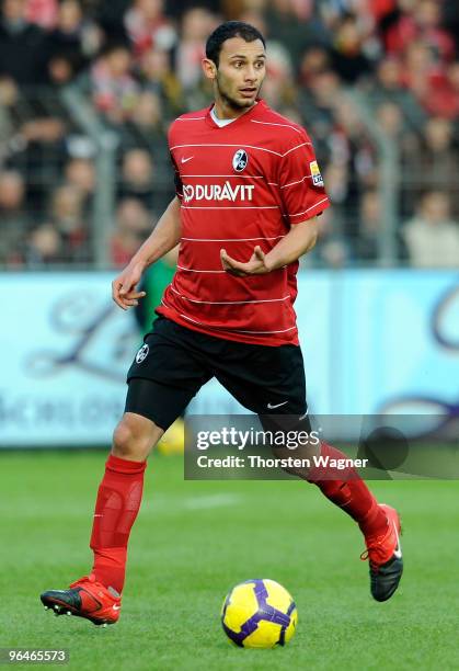 Oemer Toprak runs with the ball during the Bundesliga match between SC Freiburg and FC Schalke 04 at Badenova Stadium on February 6, 2010 in...