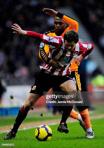 Charles N'Zogbia of Wigan battles with George McCartney of Sunderland during the Barclays Premier League match between Sunderland and Wigan Athletic...