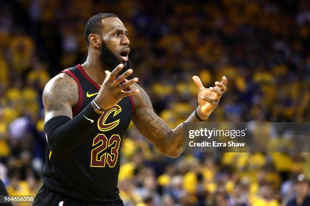 LeBron James of the Cleveland Cavaliers reacts against the Golden State Warriors in Game 1 of the 2018 NBA Finals at ORACLE Arena on May 31, 2018 in...