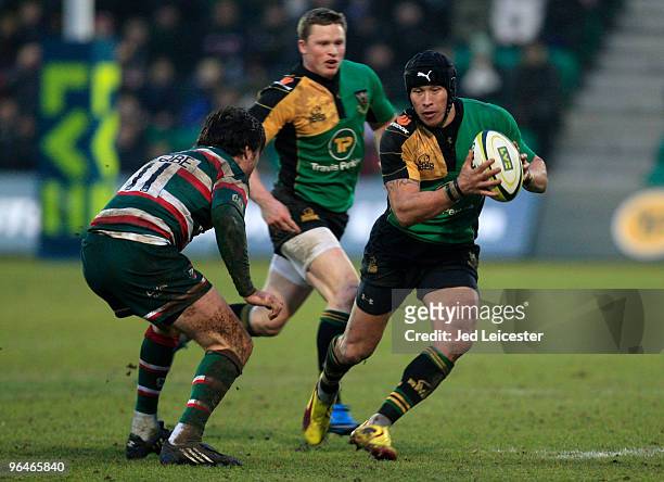 Bruce Reihana of Northampton Saints, on his 200th club appearance, tries to pass Matt Smith of Leicester Tigers during the LV Anglo Welsh Cup match...
