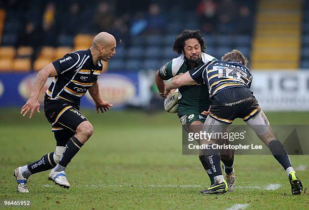 Seilala Mapusua of Irish is tackled by Chris Pennell of Worcester during the LV= Cup match between Worcester Warriors and London Irish at Sixways...