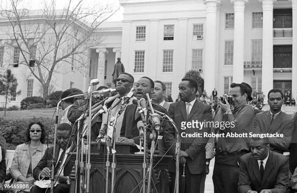 The Reverend Dr. Martin Luther King, Jr. Addresses supporters and fellow marchers outside the State Capital in Montgomery, Alabama at the end of the...