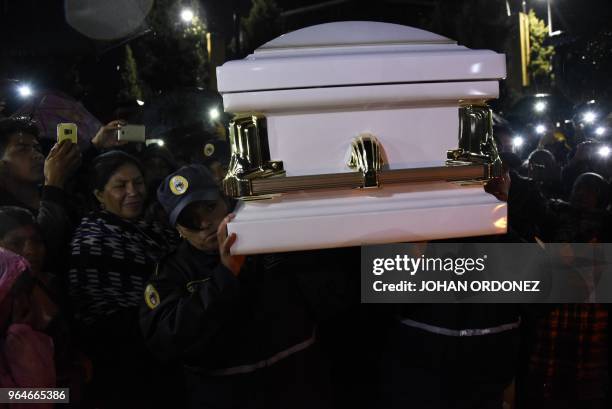 Police carry the coffin of Claudia Gomez, a 19-year-old Guatemalan woman who was allegedly shot and killed by a US border patrol agent, after it...