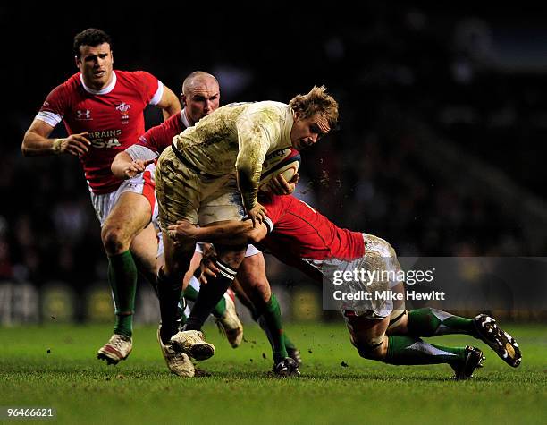 Mathew Tait of England is tackled by Martyn Williams of Wales during the RBS 6 Nations Championship match between England and Wales at Twickenham...