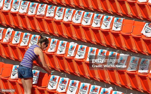 Worker at Sun Life Stadium readies seats in the upper deck of the stadium February 6, 2010 in Miami, Florida. Super Bowl XLIV between the...