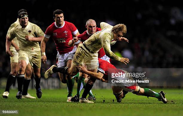 Mathew Tait of England is tackled by Martyn Williams of Wales during the RBS 6 Nations Championship match between England and Wales at Twickenham...
