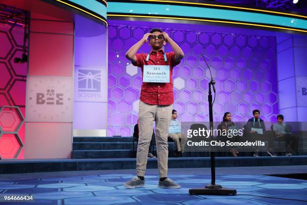 Sravanth Malla reacts after misspelling the world 'cento' during the final rounds of the 91st Scripps National Spelling Bee at the Gaylord National...