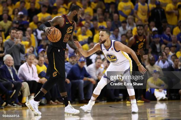 LeBron James of the Cleveland Cavaliers defended by Stephen Curry of the Golden State Warriors in Game 1 of the 2018 NBA Finals at ORACLE Arena on...