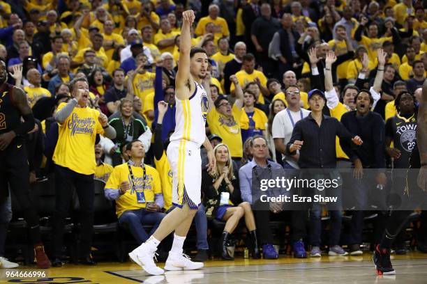 Klay Thompson of the Golden State Warriors reacts after a three pointer against the Cleveland Cavaliers in overtime during Game 1 of the 2018 NBA...