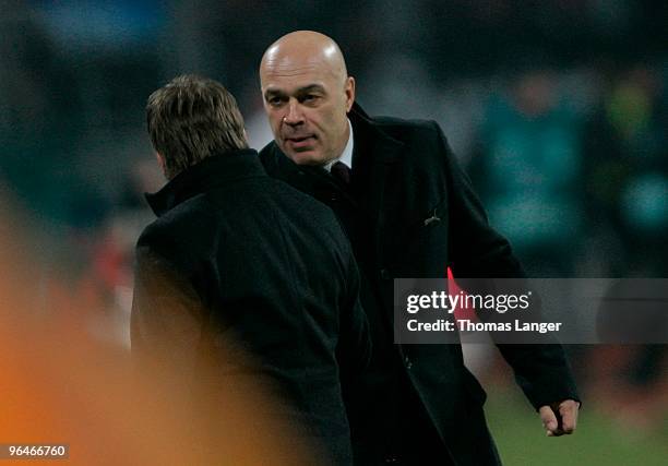 Head coach Christian Gross and Horst Heldt of Stuttgart celebrate Timo Gebharts 1-0 goal during the Bundesliga match between 1. FC Nuernberg and VfB...