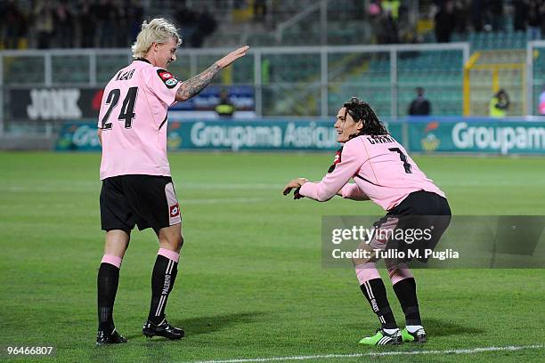 Edinson Cavani of Palermo and his team mate Simon Kjaer celebrate the opening goal during the Serie A match between Palermo and Parma at Stadio Renzo...