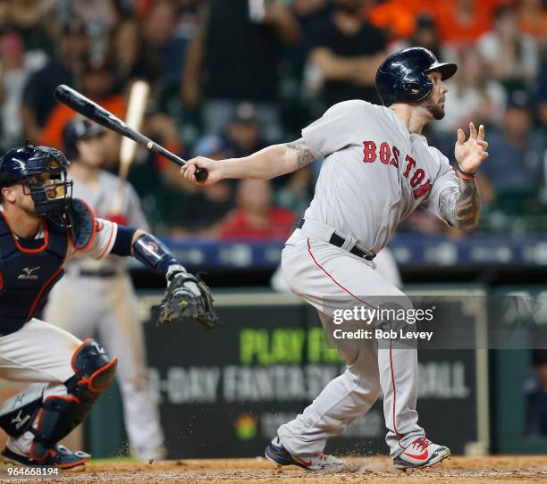 Blake Swihart of the Boston Red Sox pops out to Jake Marisnick of the Houston Astros to enf the game at Minute Maid Park on May 31, 2018 in Houston,...