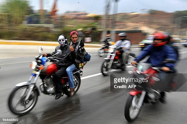 Motorcycle riders take part in the caravan known as "La Caravana del Zorro" as they head out of Guatemala City on their way to Esquipulas on February...