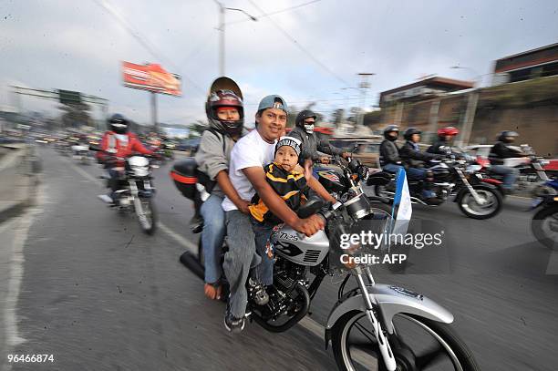 Motorcycle riders take part in the caravan known as "La Caravana del Zorro" as they head out of Guatemala City on their way to Esquipulas on February...