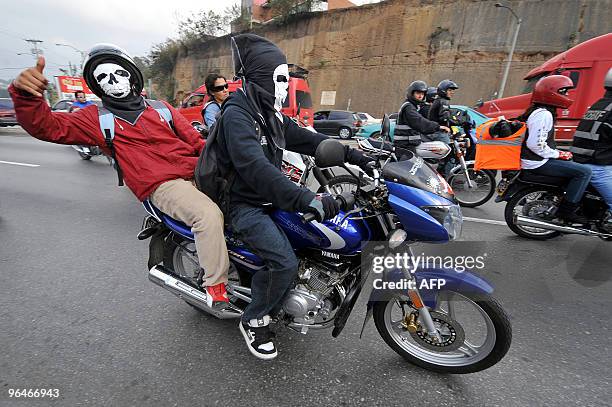 Motorcycle riders take part in the caravan known as "La Caravana del Zorro" as they head out of Guatemala City on their way to Esquipulas on February...