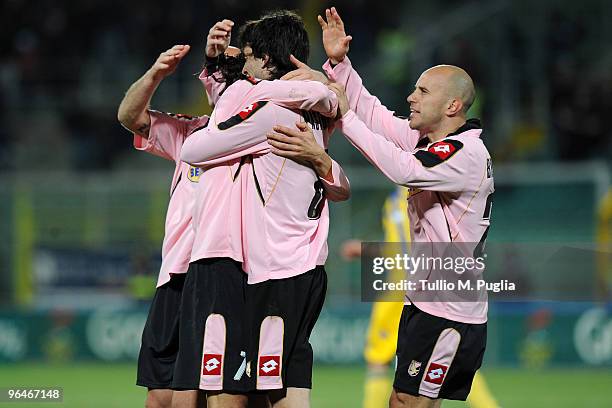 Edinson Cavani of Palermo and his team mates celebrate the opening goal during the Serie A match between Palermo and Parma at Stadio Renzo Barbera on...