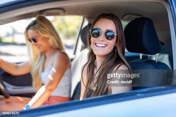 happy young women travellers in a car - road trip new south wales stock pictures, royalty-free photos & images